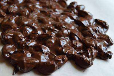 Add chocolate almonds to a baking sheet