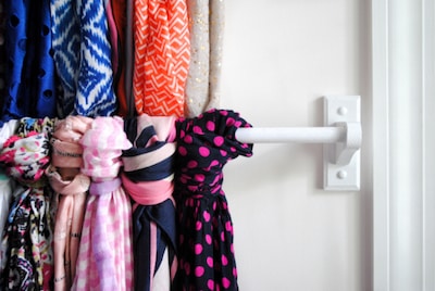 Hang scarves from a towel bar
